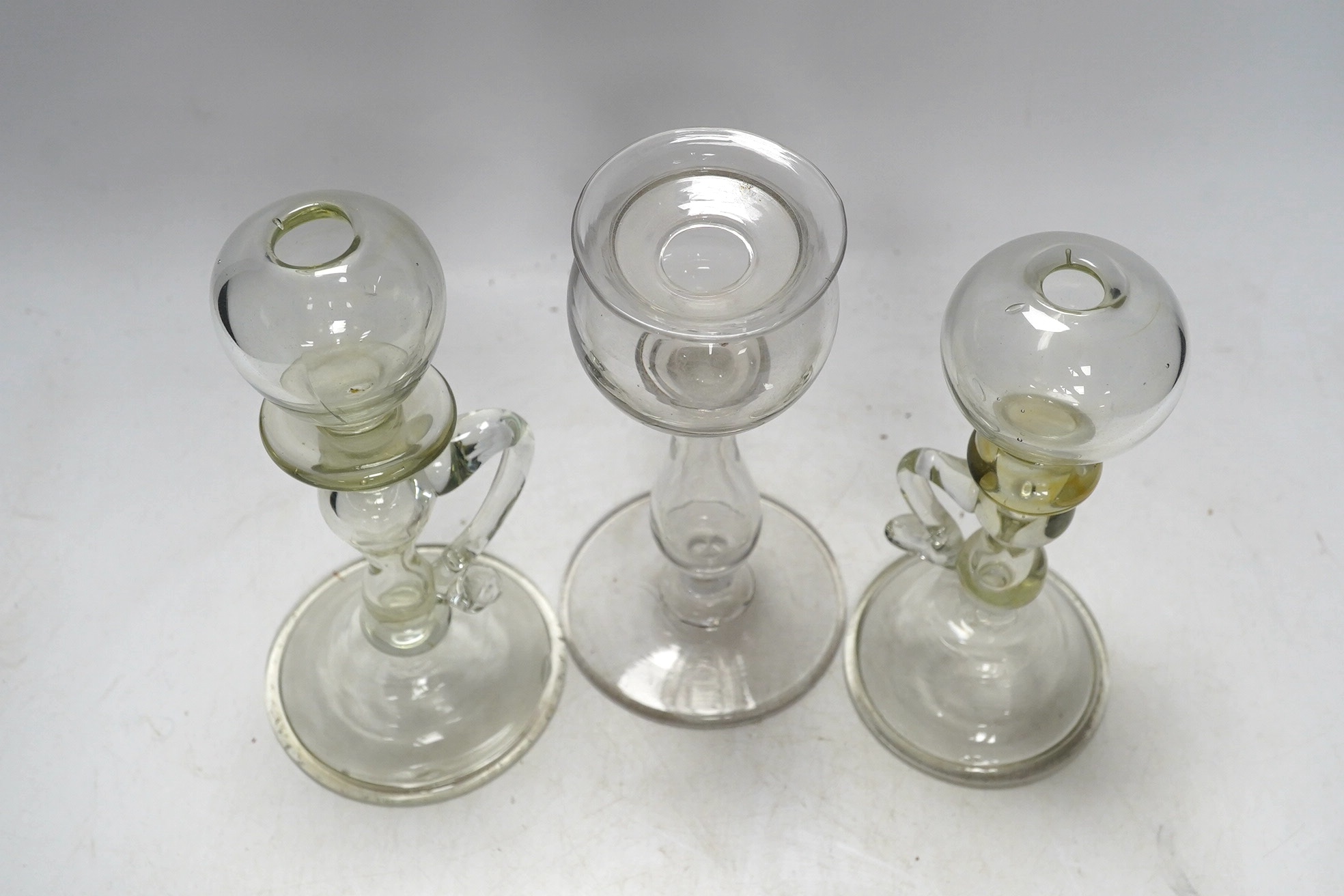 Three 18th century glass lacemaker's lamps, tallest 18cm. Condition - good